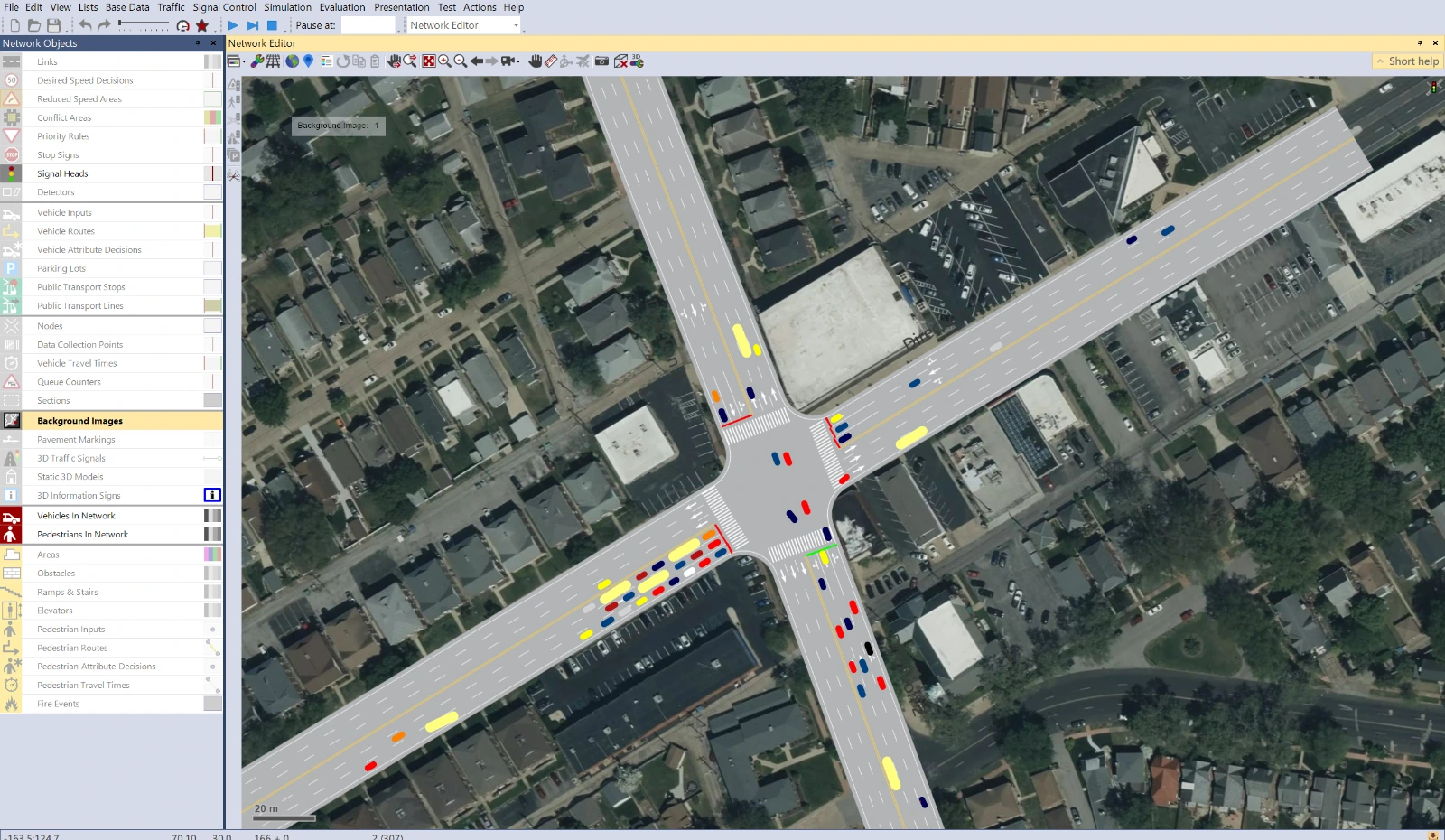 Vissim simulation with vehicles moving over a satellite-backed intersection network